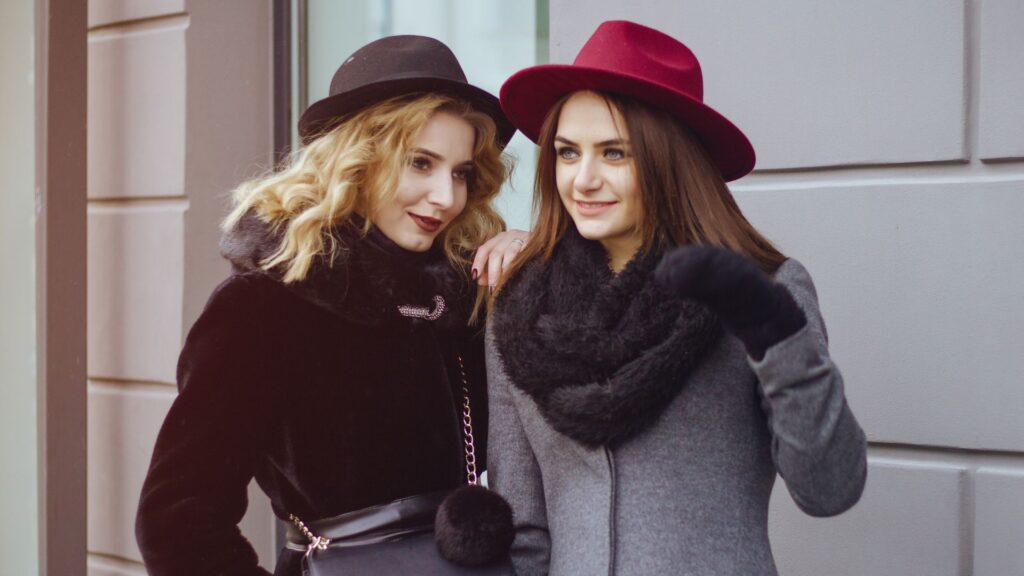 two women in winter clothes outside